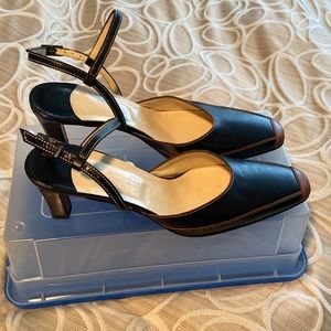 Strapped Black and Brown Cole Haan Leather Spectator Pumps